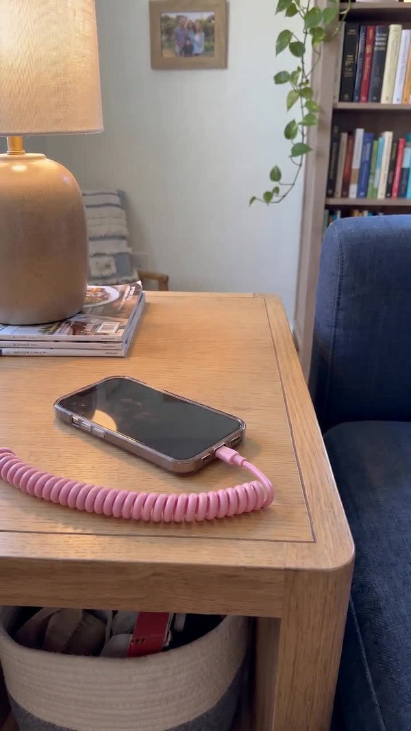 Brrring pink coiled cord connected to a phone